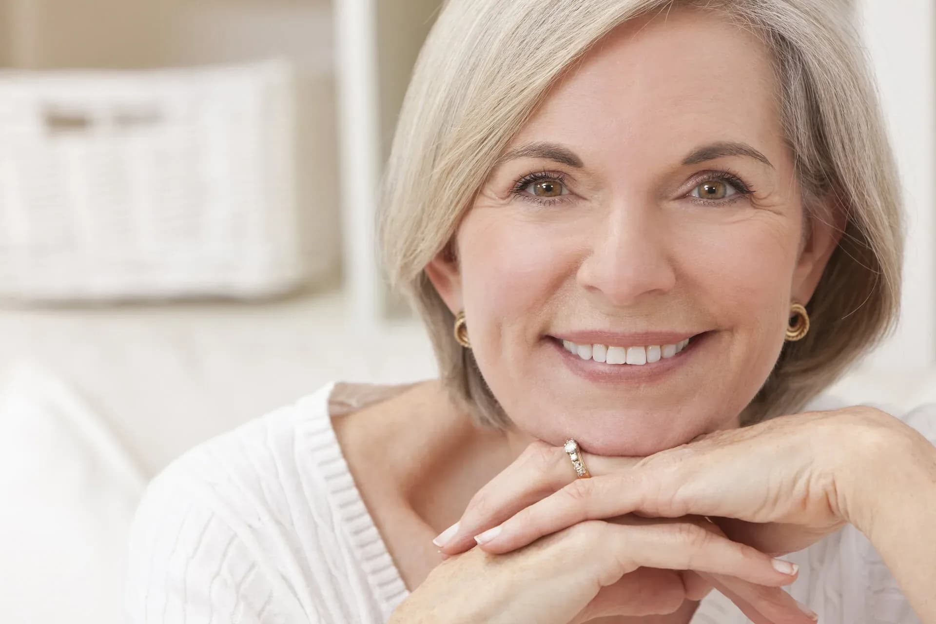 Elegant senior woman smiling and relaxed — All-on-4 dental implants at Neola Dental in Minneola, FL
