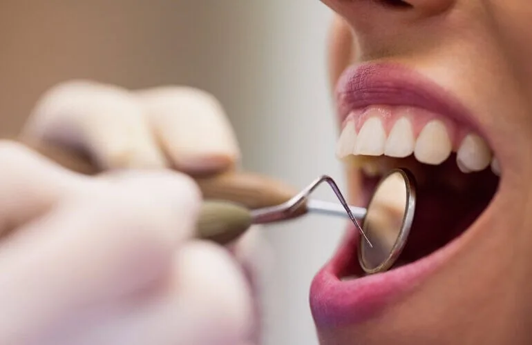 A Neola Dental dentist examining a new patient during a first visit in Minneola, FL