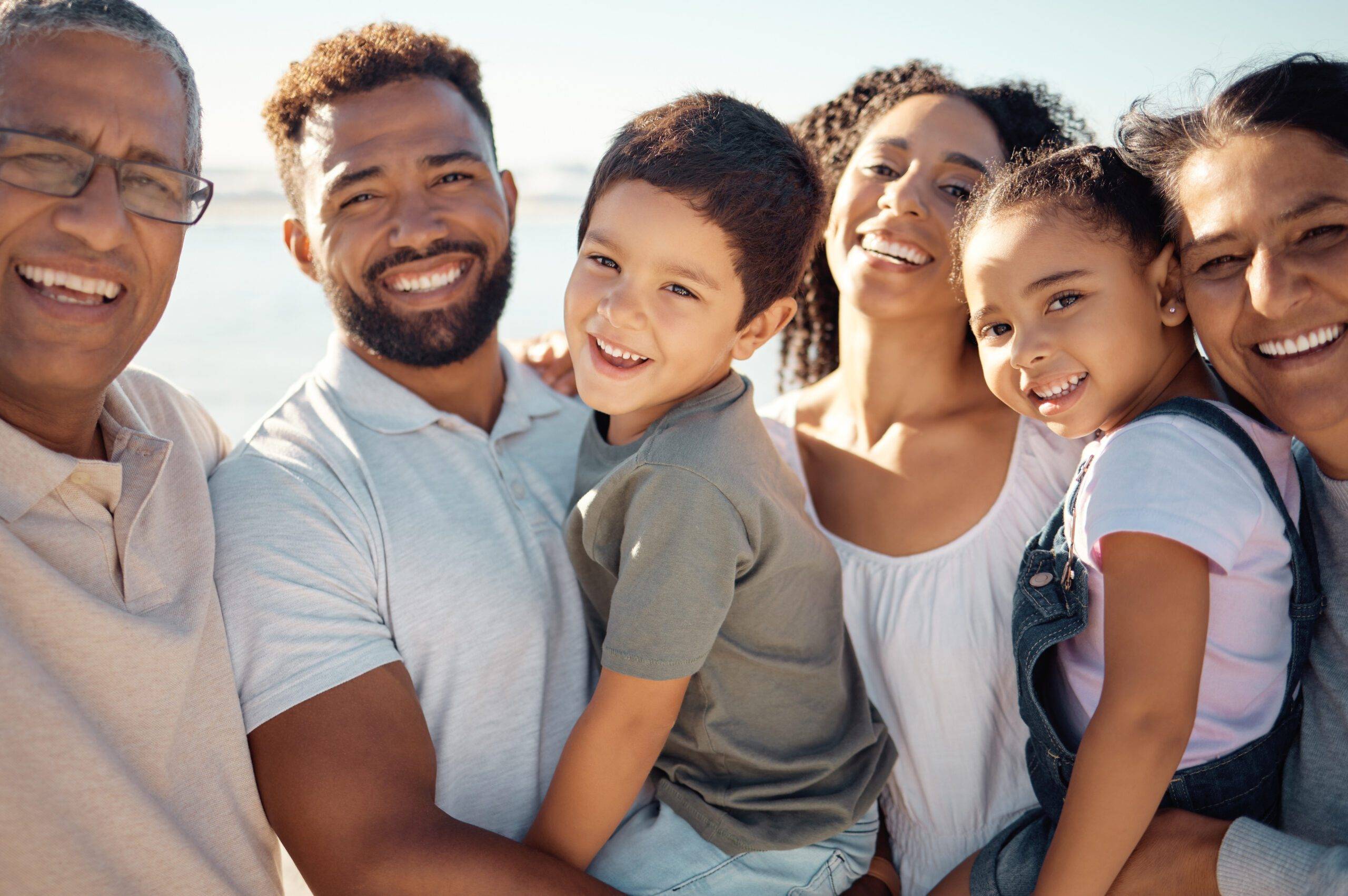 diversity big family portrait summer outdoor holiday with children grandparents blue sky sunshine happy smile grandmother father kids wellness vitamin d development